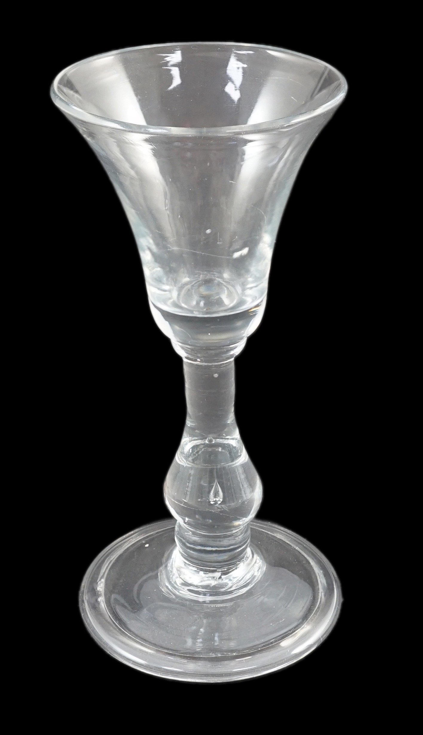 A Georgian baluster glass with teardrop air bubble stem, c.1730, 12.5cm high